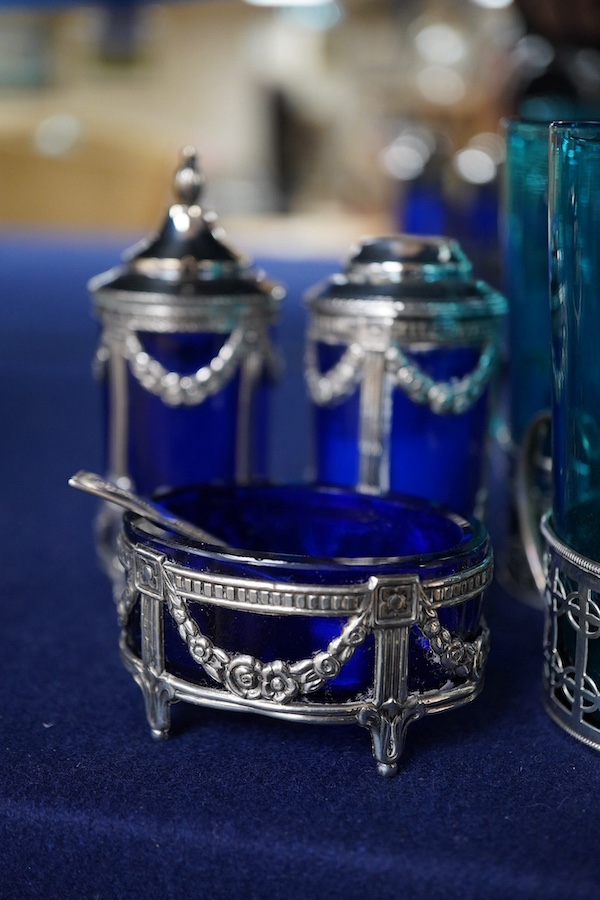 Four coloured glasses with silver stands a similar glass swan salt, a three piece cruet with white metal mounts and a plated single stem epergne, glasses and stands 9cm high., Condition - good